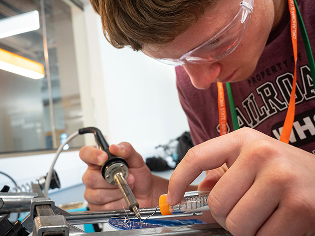 Boy soldering